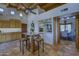 Bright kitchen with island seating, stone accents, and open layout to dining area at 1401 E Boulder Pass Pass, Carefree, AZ 85377