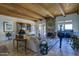 Inviting living room showcasing a stone fireplace, wood beam ceilings, and elegant furnishings at 1401 E Boulder Pass Pass, Carefree, AZ 85377