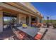 Charming outdoor dining area with stone flooring, built-in grill, and picturesque views, ideal for entertaining guests at 1401 E Boulder Pass Pass, Carefree, AZ 85377