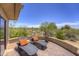Inviting patio space with lounge chairs and desert views, perfect for enjoying the outdoors in comfort and style at 1401 E Boulder Pass Pass, Carefree, AZ 85377
