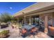 Outdoor patio featuring desert landscaping and a wrought iron dining set at 1401 E Boulder Pass Pass, Carefree, AZ 85377