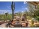 Outdoor patio featuring desert landscaping, a built-in fireplace, and BBQ at 1401 E Boulder Pass Pass, Carefree, AZ 85377