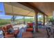 Cozy outdoor patio with stone flooring, comfortable seating, offering a serene outdoor retreat with desert views at 1401 E Boulder Pass Pass, Carefree, AZ 85377