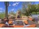 Outdoor patio featuring desert landscaping, a built-in fireplace, and BBQ at 1401 E Boulder Pass Pass, Carefree, AZ 85377