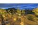 Charming desert home patio with wrought iron gate, lush vegetation, and mountain views at 1401 E Boulder Pass Pass, Carefree, AZ 85377