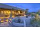 Beautiful outdoor patio with dining and lounge area featuring desert landscaping and a heater for cool evenings at 1401 E Boulder Pass Pass, Carefree, AZ 85377