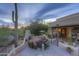 Inviting desert home patio featuring a fireplace, grill, cactus, and comfortable seating at 1401 E Boulder Pass Pass, Carefree, AZ 85377