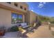 Outdoor seating area on the porch with comfortable seating perfect for relaxing and enjoying the scenery at 1401 E Boulder Pass Pass, Carefree, AZ 85377