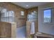 Custom tiled shower with glass block accents and a window overlooking the desert landscape at 1401 E Boulder Pass Pass, Carefree, AZ 85377