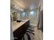 Modern bathroom showcasing a dual sink vanity, large mirror, and a luxurious walk-in shower at 15221 N Clubgate Dr # 2065, Scottsdale, AZ 85254
