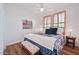 Bedroom with shuttered windows, ceiling fan and laminate wood flooring at 15221 N Clubgate Dr # 2065, Scottsdale, AZ 85254