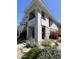 Multi-story home boasts lush landscaping with mature trees, plants, and rocky areas at 15221 N Clubgate Dr # 2065, Scottsdale, AZ 85254