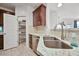 Clean kitchen features stainless steel appliances, granite countertops, pantry, and a sleek sink at 15221 N Clubgate Dr # 2065, Scottsdale, AZ 85254