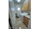 Bright laundry room with tile floor and built in cabinets at 15221 N Clubgate Dr # 2065, Scottsdale, AZ 85254