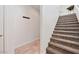 Carpeted staircase leads to the upper level of the home at 15221 N Clubgate Dr # 2065, Scottsdale, AZ 85254