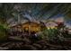 A charming backyard featuring a spacious patio, lush landscaping, and a serene outdoor living space at 15797 W Cinnabar Dr, Surprise, AZ 85374