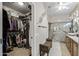 Ensuite bathroom with walk-in shower, walk-in closet, and ceiling fan at 15797 W Cinnabar Dr, Surprise, AZ 85374