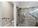 Elegant bathroom with a glass shower and accessibility bars at 15797 W Cinnabar Dr, Surprise, AZ 85374