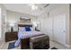 This primary bedroom features a decorative trunk and sliding closet doors at 15797 W Cinnabar Dr, Surprise, AZ 85374