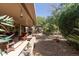 Inviting covered patio with comfortable seating provides an ideal space for relaxation and outdoor enjoyment at 15797 W Cinnabar Dr, Surprise, AZ 85374