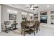 Charming dining room with a vintage rocking chair and decorative art and shelving at 15797 W Cinnabar Dr, Surprise, AZ 85374