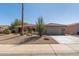 Charming home with desert landscaping, tile roof, and a spacious two-car garage at 15797 W Cinnabar Dr, Surprise, AZ 85374