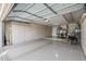Well-maintained garage with epoxy floors, built in storage, and plenty of room at 15797 W Cinnabar Dr, Surprise, AZ 85374