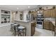 Well-equipped kitchen with stainless steel appliances, breakfast bar, and ample counter space at 15797 W Cinnabar Dr, Surprise, AZ 85374