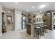 Bright kitchen featuring stainless steel appliances, breakfast bar, and ample cabinet space at 15797 W Cinnabar Dr, Surprise, AZ 85374