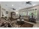 Spacious living room featuring comfortable seating, neutral tones, and plenty of natural light at 15797 W Cinnabar Dr, Surprise, AZ 85374