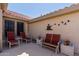 Relaxing patio area with comfortable seating and charming decor, perfect for enjoying outdoor living at 15797 W Cinnabar Dr, Surprise, AZ 85374