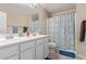 Bright bathroom featuring double sinks, ample counter space, and a shower-tub combination at 15812 W Lisbon Ln, Surprise, AZ 85379