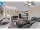 Spacious living room area that flows into dining area and modern kitchen at 15812 W Lisbon Ln, Surprise, AZ 85379