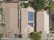 Aerial view of a neighborhood showcasing a home with solar panels on the roof at 16235 W Cottonwood St, Surprise, AZ 85374