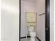 Small bathroom featuring a modern toilet, storage cabinet, and a towel rack at 16235 W Cottonwood St, Surprise, AZ 85374