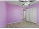 Bright bedroom features a ceiling fan, and a double-door closet adjacent to an entrance at 16235 W Cottonwood St, Surprise, AZ 85374