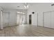 Spacious bedroom with high ceiling, ceiling fan, neutral walls, tile floors, closet, and a window with curtains at 16235 W Cottonwood St, Surprise, AZ 85374