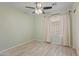 Bedroom with wood-look floors, neutral paint, and ample natural light at 16235 W Cottonwood St, Surprise, AZ 85374