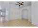 Well-lit dining area with custom storage and decorative ceiling fan at 16235 W Cottonwood St, Surprise, AZ 85374