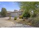 Charming single-story home featuring a tile roof, a two-car garage, and well-maintained desert landscaping at 16235 W Cottonwood St, Surprise, AZ 85374
