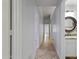Hallway view with a bathroom featuring granite countertops at 16235 W Cottonwood St, Surprise, AZ 85374