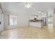 Open layout showcasing the kitchen, stainless appliances, granite countertops, and natural light at 16235 W Cottonwood St, Surprise, AZ 85374