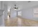 Open and airy living space with tile flooring, a ceiling fan, and natural light streaming through the window at 16235 W Cottonwood St, Surprise, AZ 85374
