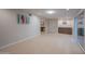 Spacious basement with tile flooring, ample natural light, and built-in storage cabinets at 1644 W Roma Ave, Phoenix, AZ 85013