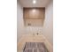 Bright laundry room features overhead cabinets and modern hookups for a washer and dryer at 1644 W Roma Ave, Phoenix, AZ 85013