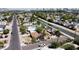 Expansive aerial view of a residential neighborhood with a canal and downtown skyline at 1644 W Roma Ave, Phoenix, AZ 85015