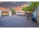 Wide driveway leading to the garage and a spacious backyard with desert landscaping at 1644 W Roma Ave, Phoenix, AZ 85015