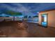 Backyard featuring a fire pit, a tree, privacy wall, and a shed with an open door at 1644 W Roma Ave, Phoenix, AZ 85015