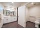 Modern bathroom features a double vanity, granite countertops, and grab bars for accessibility at 1644 W Roma Ave, Phoenix, AZ 85015