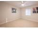 Bedroom features tile flooring, a ceiling fan and a window with blinds at 1644 W Roma Ave, Phoenix, AZ 85015